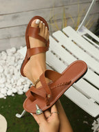 Women's vegan leather toe-loop flat sandals by Trendsi, minimalist and comfortable summer shoes, featuring stylish open-toe design.