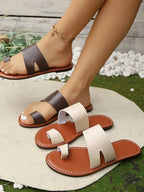 Women's vegan PU leather toe loop flat sandals with comfortable design, perfect for everyday wear, by Trendsi.