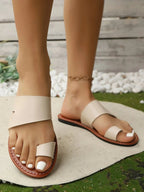 Women's vegan PU leather toe-loop flat sandals by Trendsi, showcasing comfortable everyday footwear with a stylish flat design.