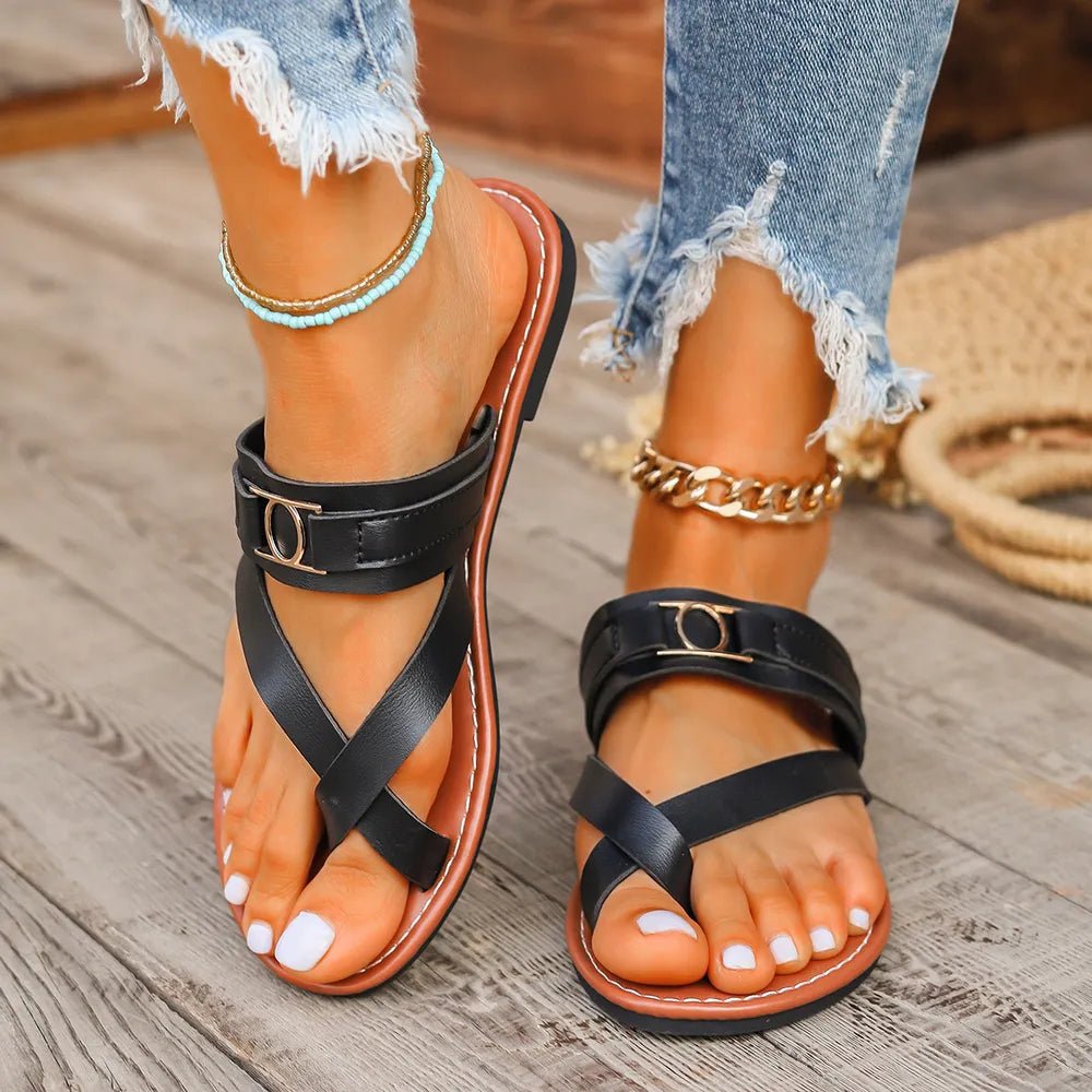 Women's minimalist toe loop flat sandals by Trendsi, featuring a sleek design and open toe style.