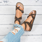 Women's chic PU leather toe loop flat sandals featuring a minimalist design, perfect for summer casual wear.