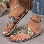 Women's PU leather toe-loop flat sandals by Trendsi, minimalist summer slides featuring comfortable design and sleek style.
