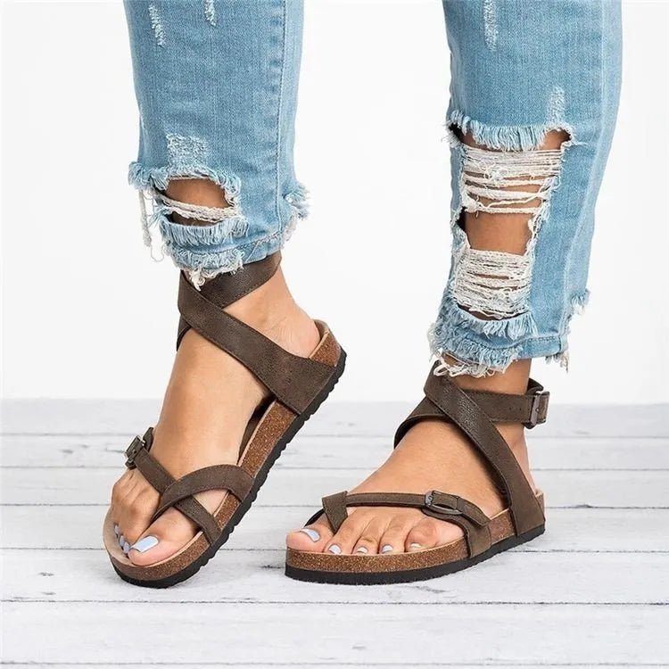 Women's chic PU leather toe loop flat sandals from Trendsi, minimalist summer footwear with open toe design.