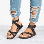 Women's chic PU leather toe loop flat sandals featuring minimalist summer design, perfect for warm-weather casual wear.