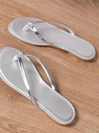 Women's chic PU leather toe post flat sandals with comfortable summer design, featuring minimalist straps and a sleek, stylish look.