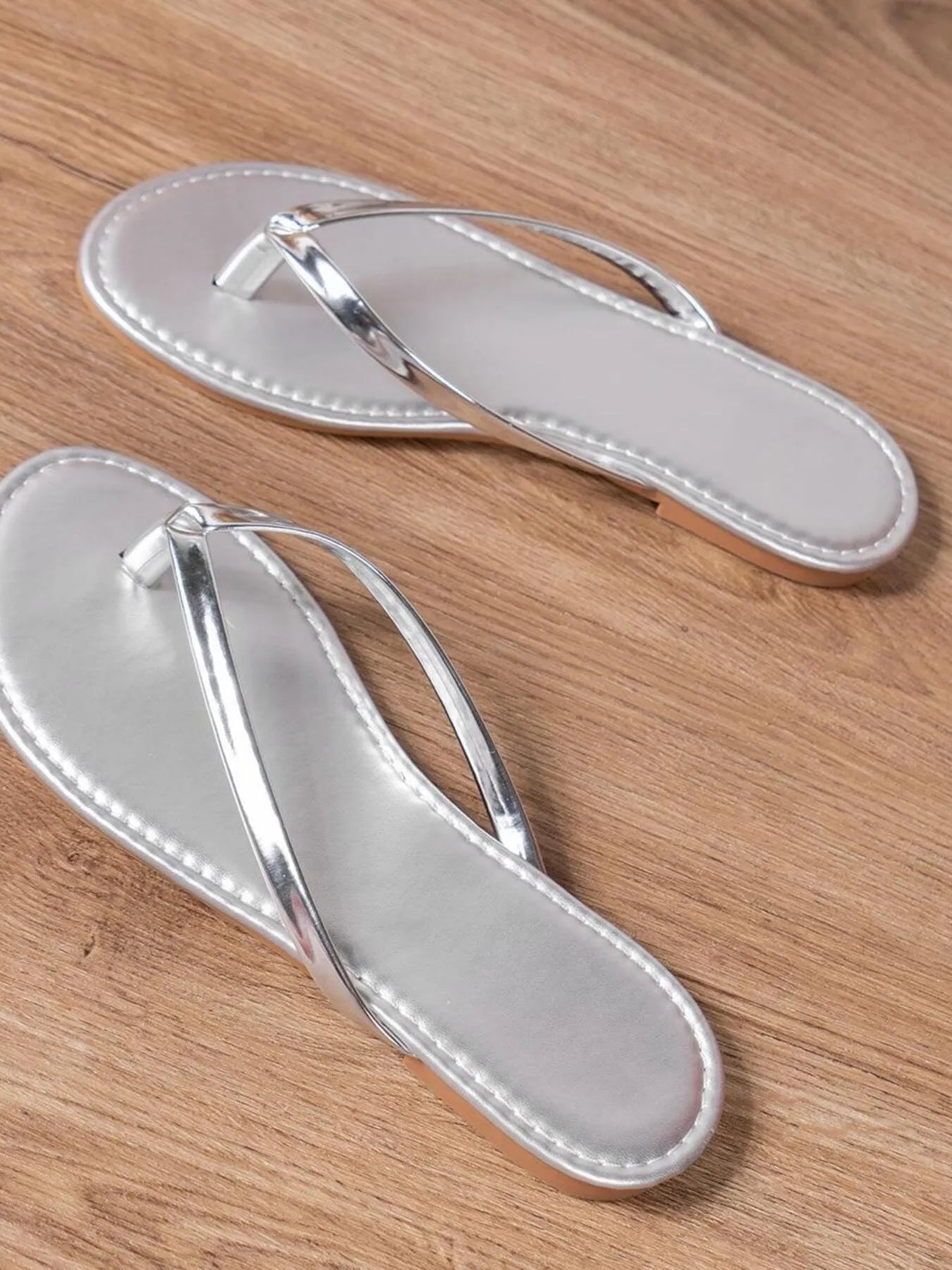Women's chic PU leather toe post flat sandals with comfortable summer design, featuring minimalist straps and a sleek, stylish look.
