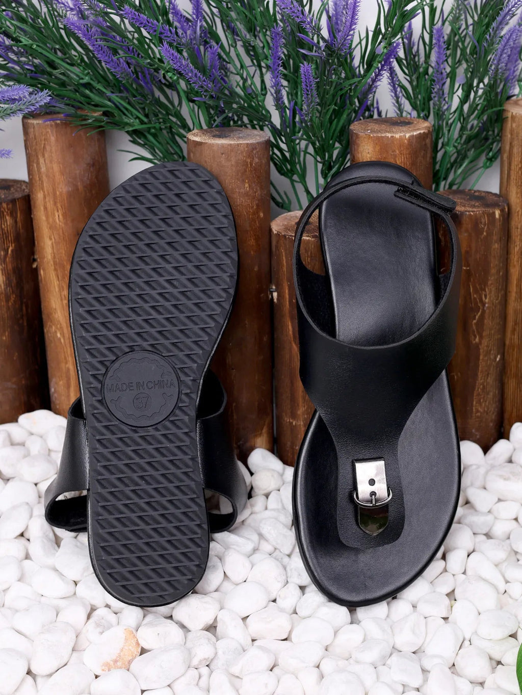 Women's comfortable PU leather toe-post flat sandals with elegant casual design, featuring minimalist straps and a flat sole.