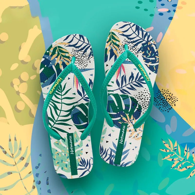 Women's tropical leaf print flat slides from Trendsi, lightweight botanical summer sandals with vibrant tropical leaf design.