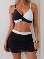 Women's two-tone cami and skort swim set, stylish two-piece swimwear, featuring a fitted cami top and matching skort for beach or pool.