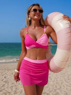 Women's two-tone cami and skort swim set by Trendsi, stylish two-piece swimwear perfect for beach or poolside.
