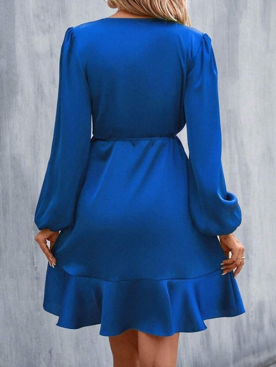Elegant V-neck satin midi dress with a fitted waist and low cut, perfect for casual or semi-formal occasions by Bella Mia.