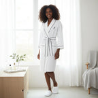 White knee-length waffle robe for women by Plush Fashion Hub, featuring soft fabric and a cozy, relaxed fit.