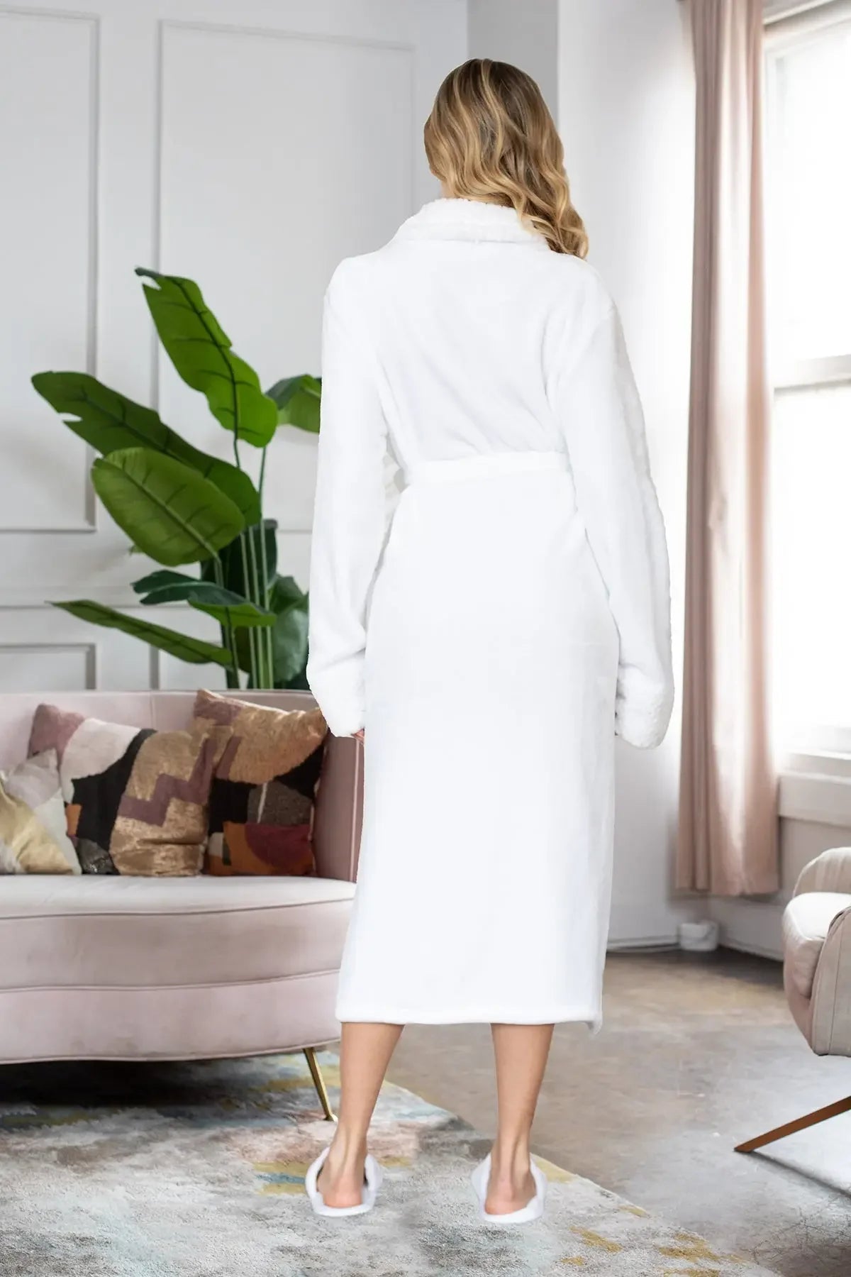 White women's ultra-soft plush bathrobe from Plush Fashion Hub, cozy and comfortable with a relaxed fit.