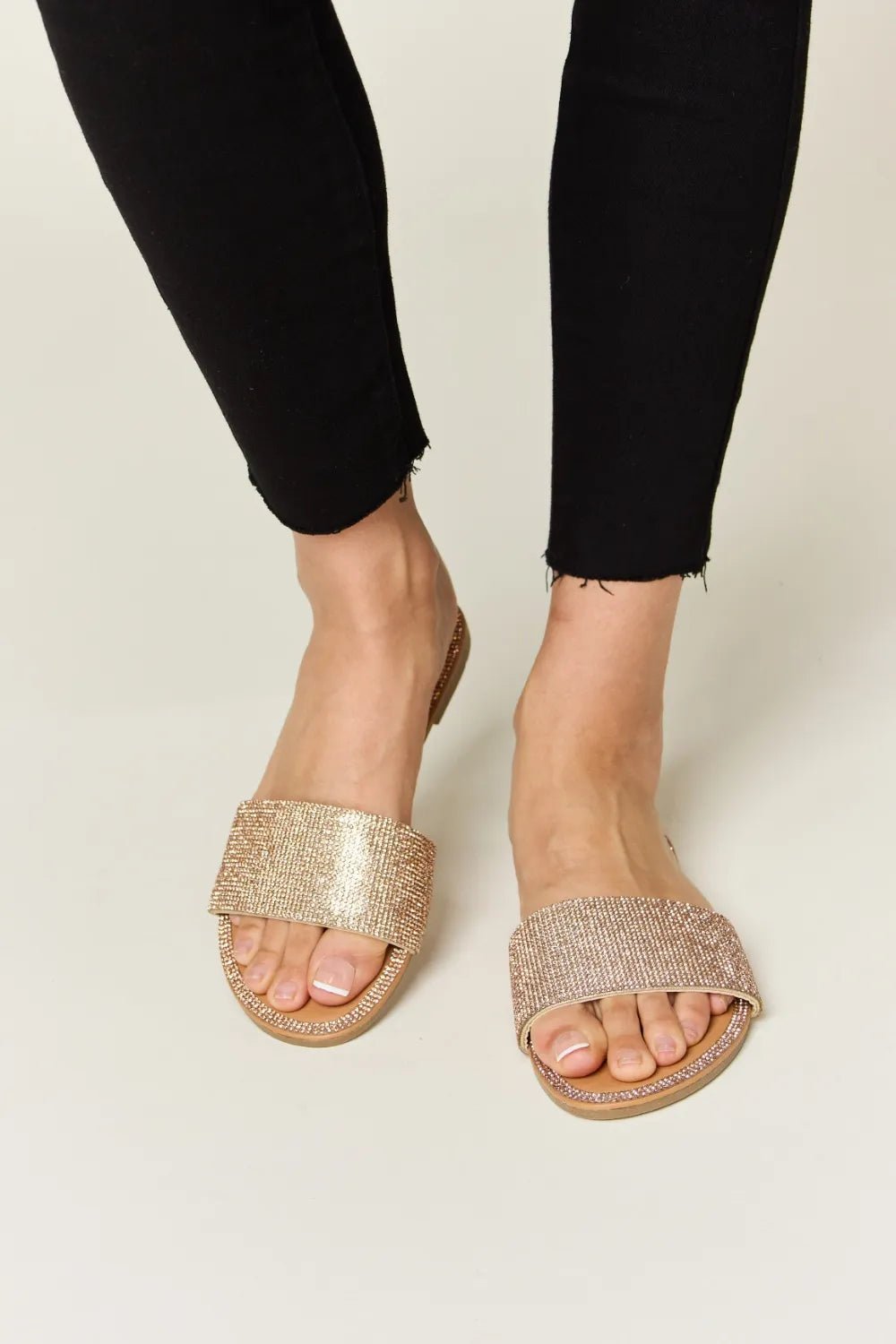 Women's rhinestone open toe flat sandals by Trendsi with sparkling details, perfect for summer footwear and stylish warm-weather looks.