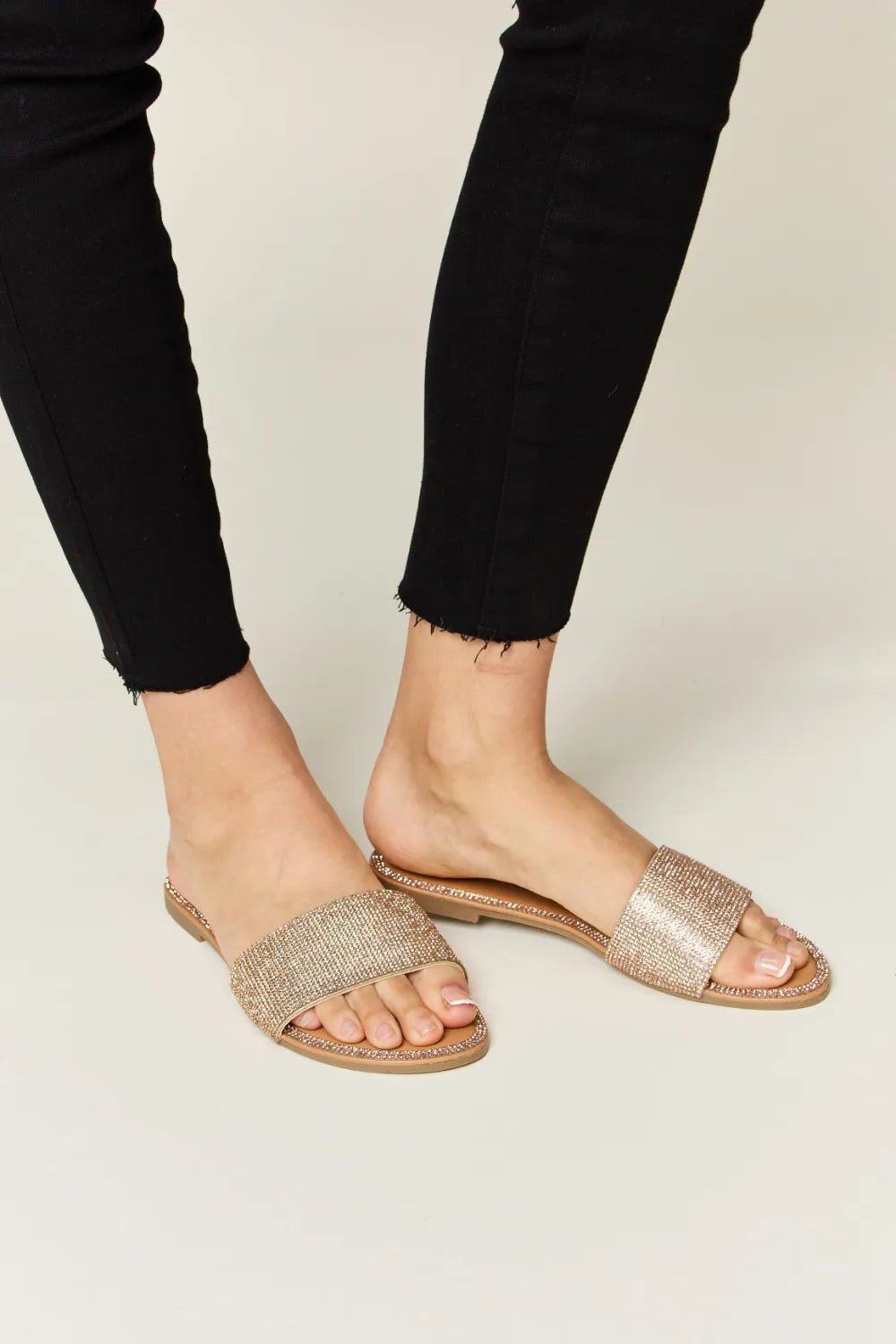 Women's rhinestone open toe flat sandals by Trendsi, sparkling summer footwear with glittering rhinestone details and comfortable flat sole.