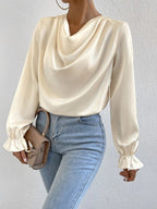 Women’s satin shirt with ruffled sleeves from Bella Mia, long sleeve design perfect for autumn fashion.