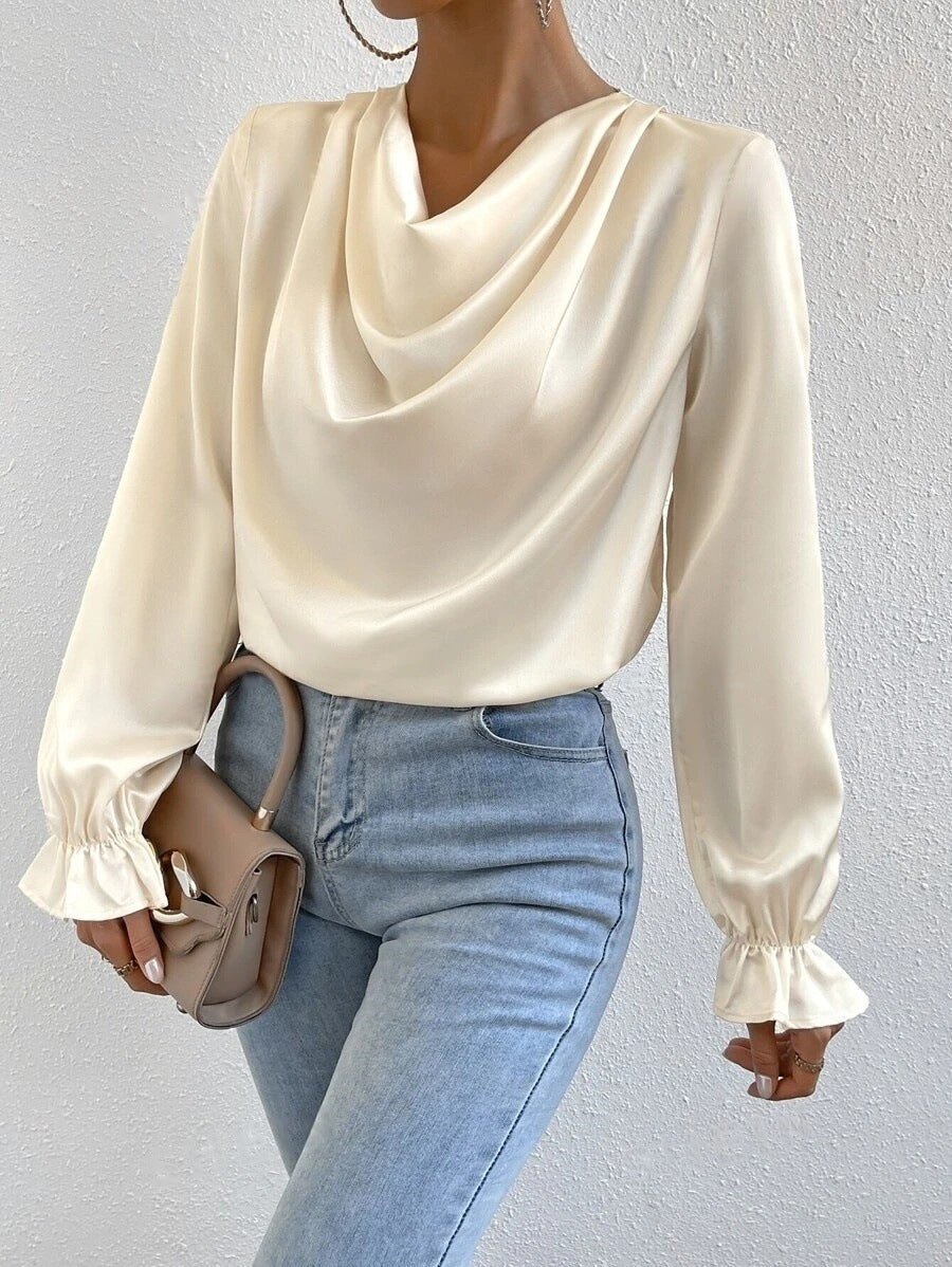 Women’s satin shirt with ruffled sleeves from Bella Mia, long sleeve design perfect for autumn fashion.