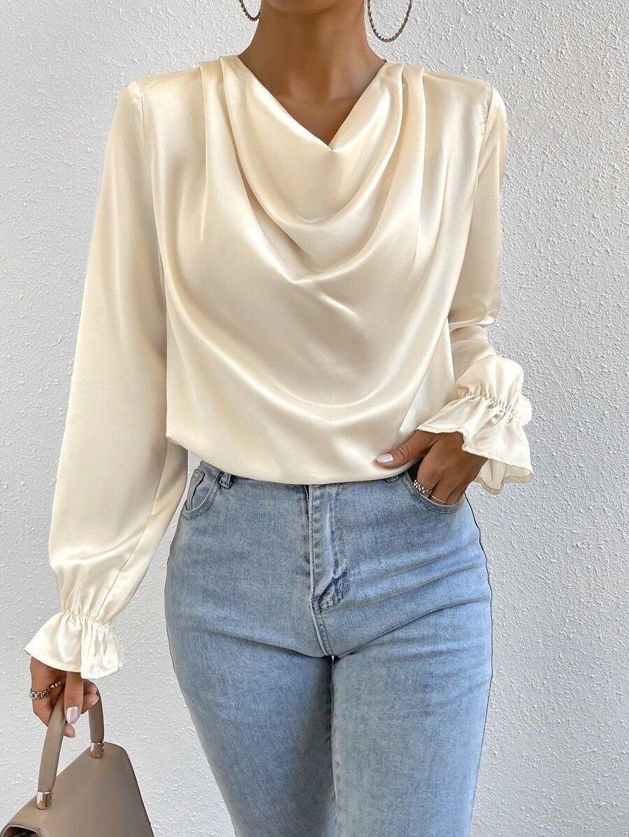 Women’s satin shirt with ruffled sleeves from Bella Mia, long sleeve design perfect for autumn fashion.