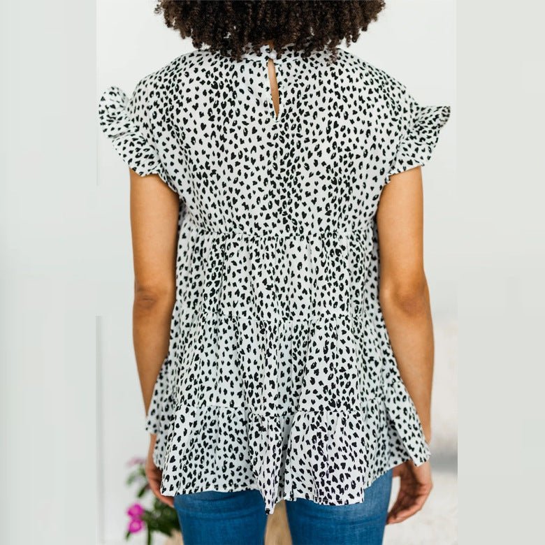 Women’s floral small short sleeve swing shirt by Bella Mia, stylish women’s top with a feminine floral pattern and relaxed fit.
