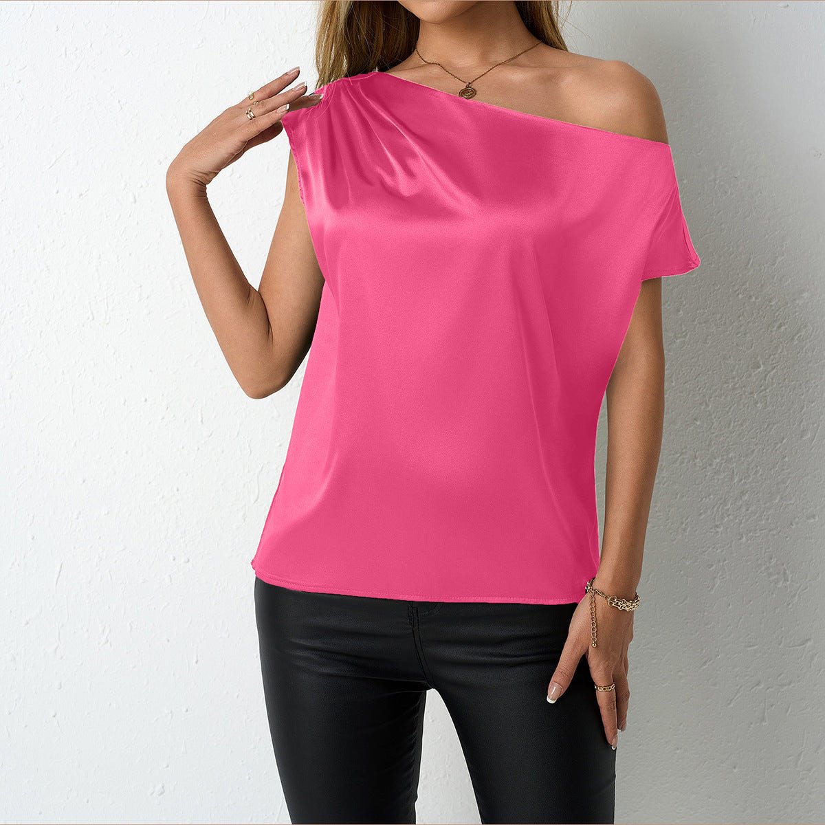 Women’s satin off-shoulder sleeveless top by Bella Mia, featuring an irregular asymmetric design in artificial silk for spring and summer.