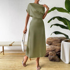 Women wearing Bella Mia trendy summer satin dress and tight jumpsuit, long satin dress perfect for warm-weather style.