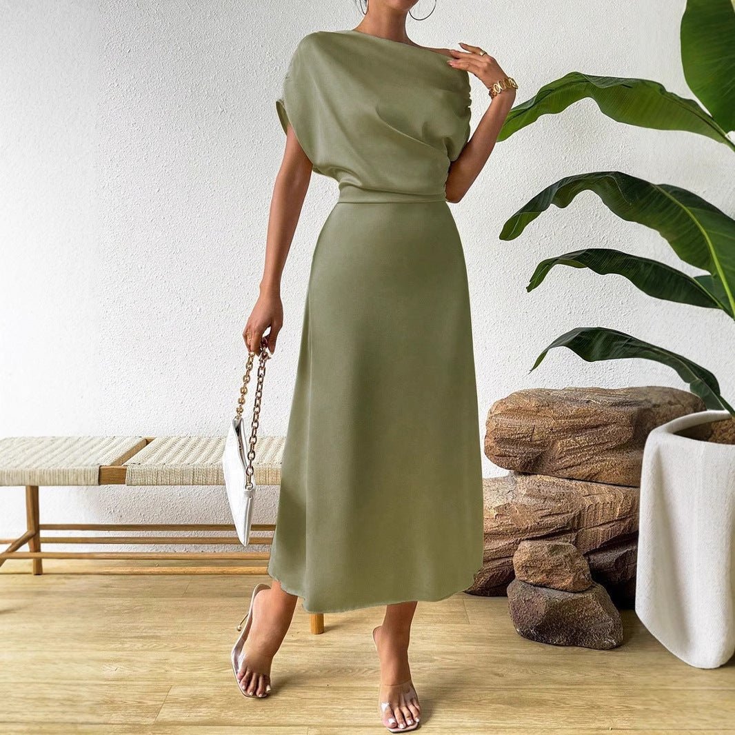 Women wearing Bella Mia trendy summer satin dress and tight jumpsuit, long satin dress perfect for warm-weather style.