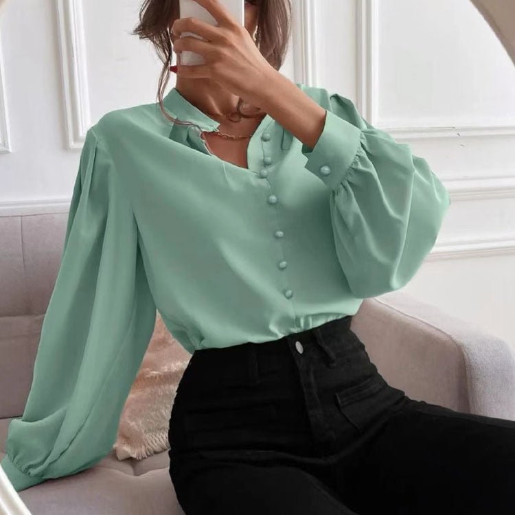 Elegant solid color women's autumn shirt with collar, long sleeves, and button closure by Bella Mia, loose fit top.