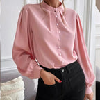 Elegant women’s long sleeve autumn shirt by Bella Mia, solid color, collared, loose fit with single row button detail.
