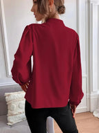 Elegant women’s long sleeve autumn shirt by Bella Mia with solid color, collared design, single row buttons, and a loose fit.