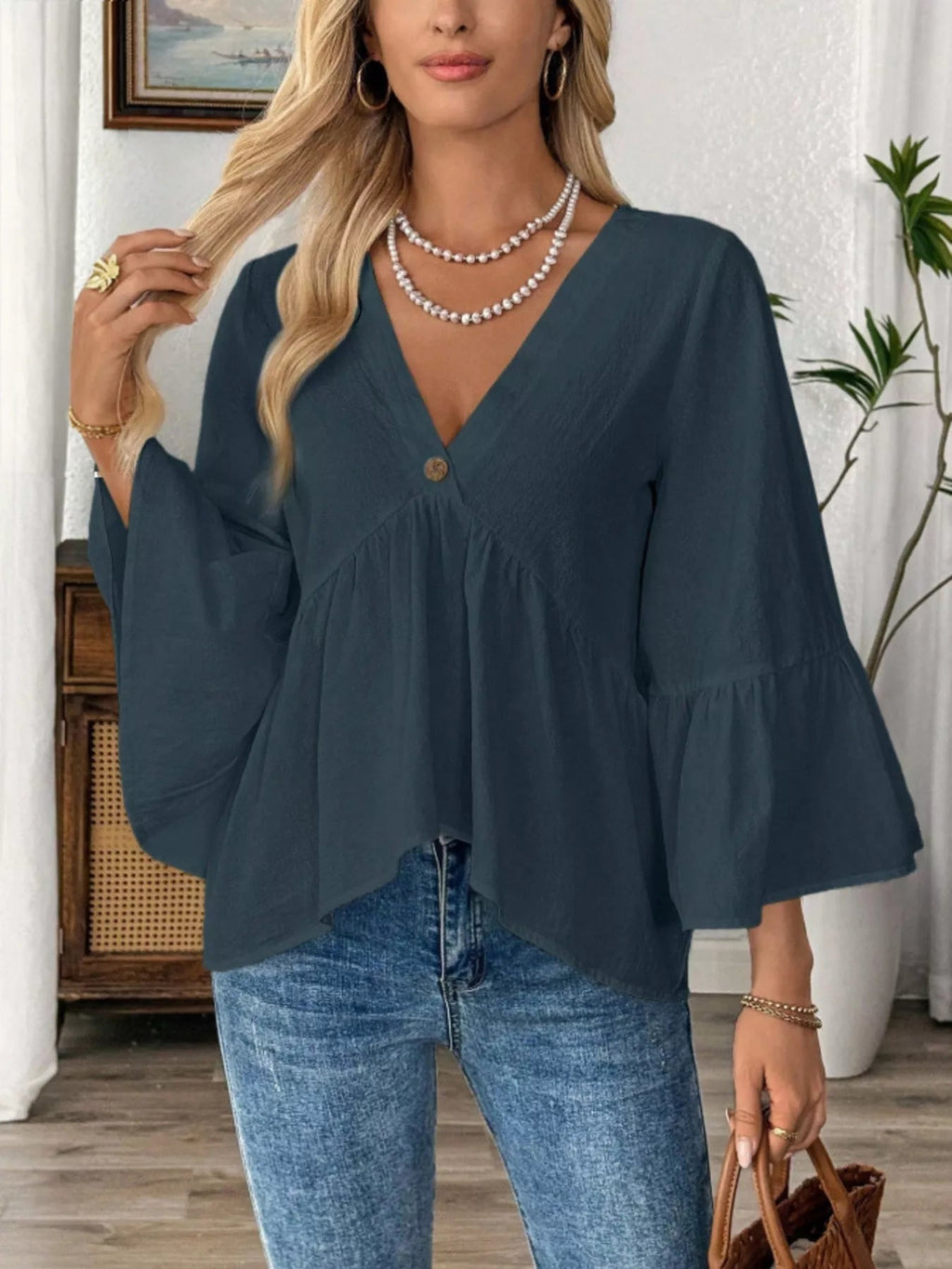 Women's 100% cotton V-neck bell sleeve blouse with a relaxed fit, casual chic style, featuring flowy bell sleeves.