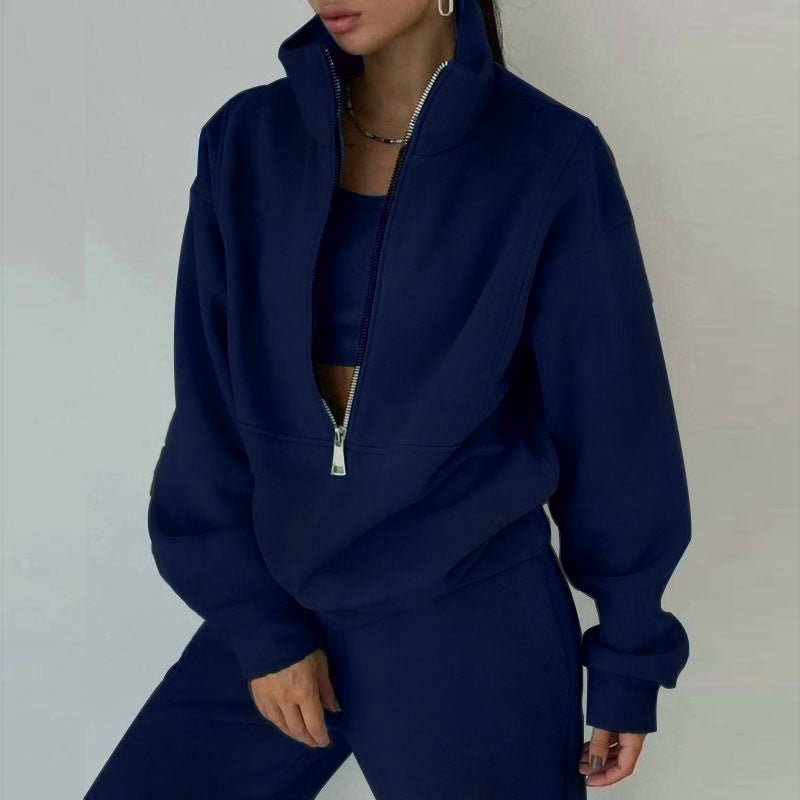 Women’s 2-piece zip neck long sleeve sweatshirt and slim fit pants casualwear set by Plush Fashion Hub, shown on a model.