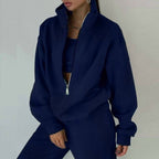 Women’s 2-piece zip neck long sleeve sweatshirt and slim fit pants casualwear set by Plush Fashion Hub, shown on a model.