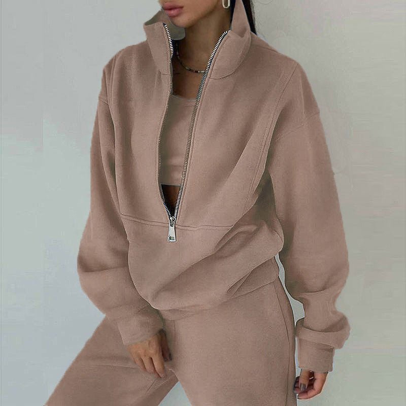Women's casualwear 2-piece zip-neck long sleeve sweatshirt and slim fit pants set by Plush Fashion Hub, styled for comfort and everyday wear.
