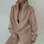 Women's casualwear 2-piece zip-neck long sleeve sweatshirt and slim fit pants set by Plush Fashion Hub, styled for comfort and everyday wear.