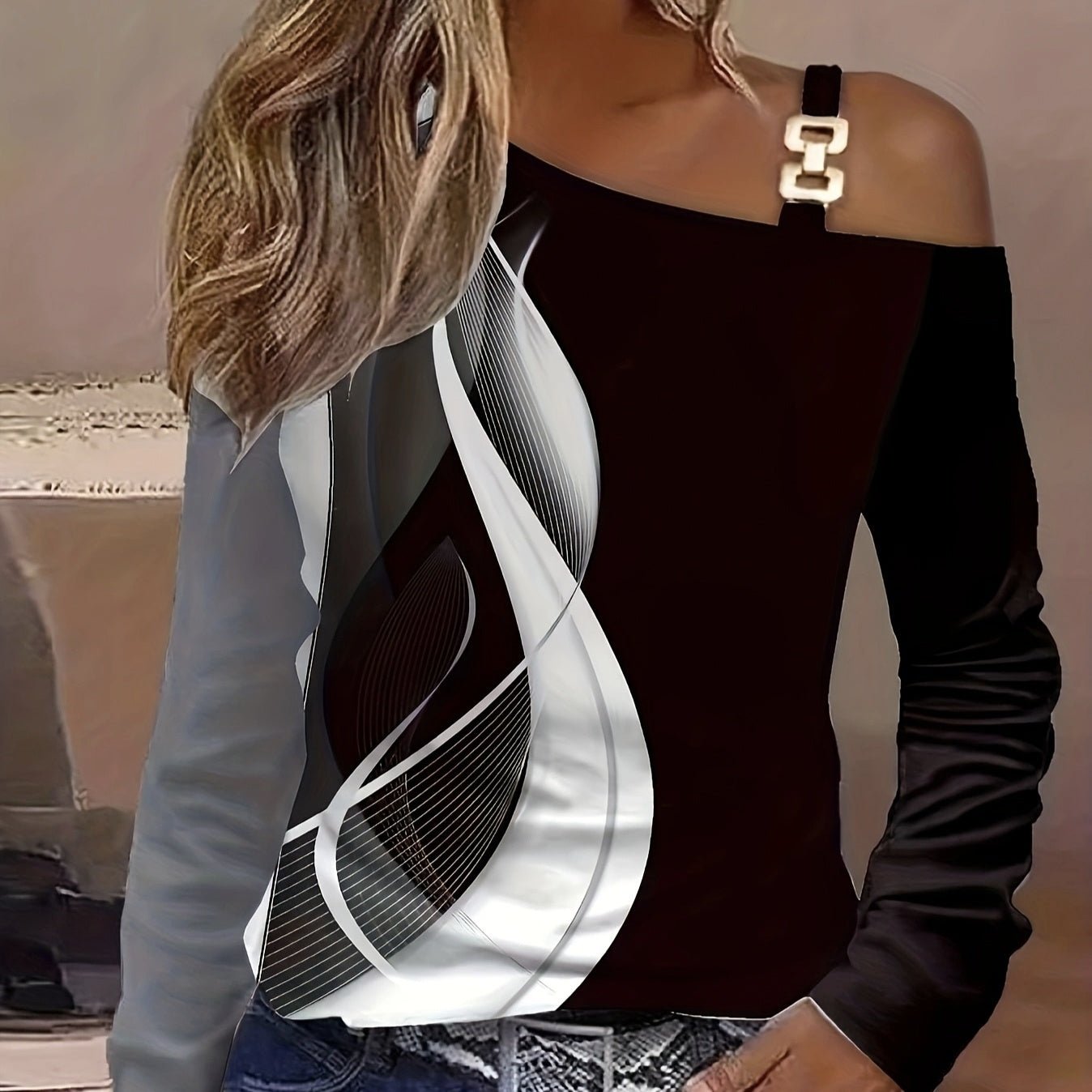 Women's asymmetrical buckle shoulder casual top by Plush Fashion Hub, featuring stylish shoulder design and modern fashion details.