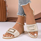 Women's open toe flat sandals with buckle decor, comfortable slip-on design in PU leather, perfect for casual wear.
