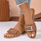 Women's open-toe flat sandals with buckle decor, comfortable PU leather slip-ons from Trendsi, perfect for casual summer wear.