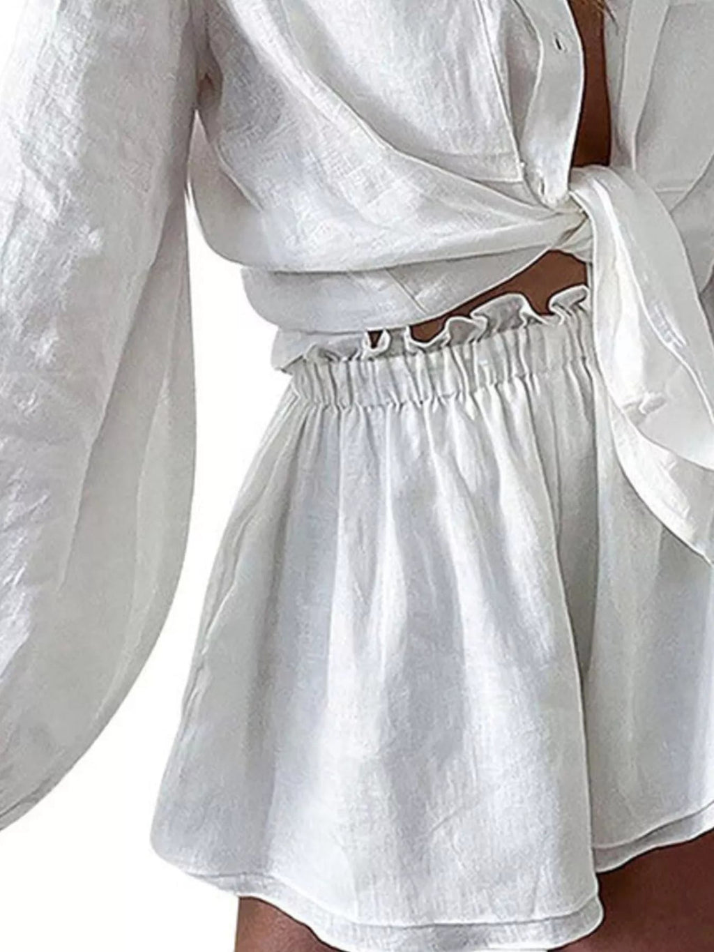 Women's button-up long sleeve shirt and shorts two-piece lounge set by Trendsi, casual comfortable clothing set for relaxation.