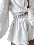 Women's button-up long sleeve shirt and shorts two-piece lounge set by Trendsi, casual comfortable clothing set for relaxation.