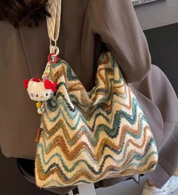 Womens casual ethnic-style embroidered crossbody shoulder bag with colorful patterns and intricate threadwork, designed for everyday wear.