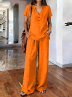 Women’s casual solid color two-piece set by Plush Fashion Hub, featuring a relaxed fit top and matching pants.