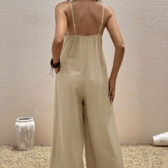 Women’s sleeveless casual suspender jumpsuit with V-neck, solid color, one-piece design by Plush Fashion Hub.