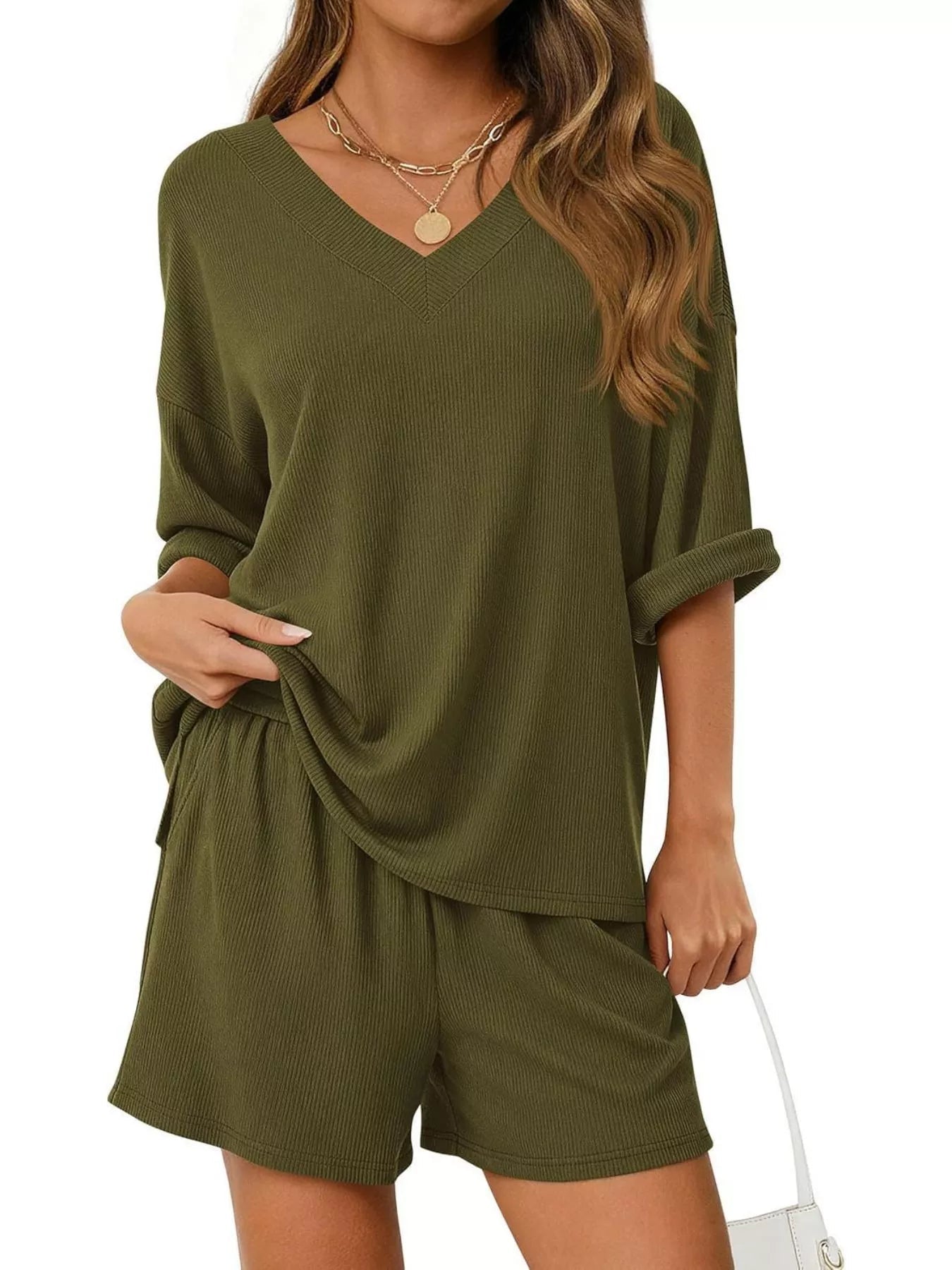 Women's casual V-neck top and shorts set, solid color two-piece outfit by Trendsi, shown on a model.