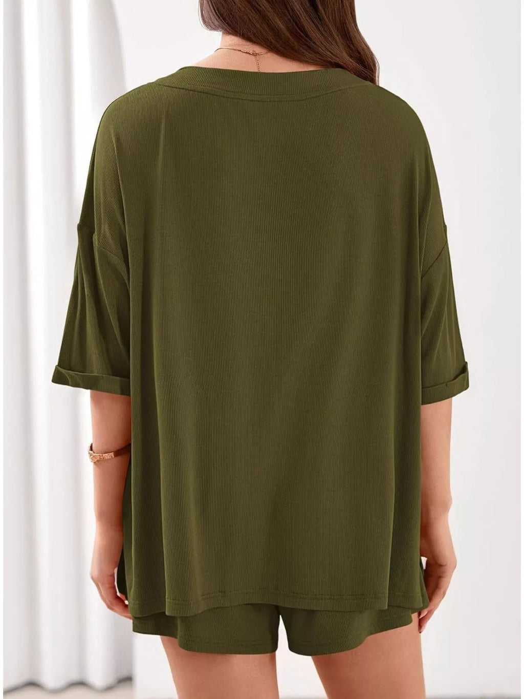 Women's casual V-neck top and shorts set in solid color, trendy two-piece outfit by Trendsi, perfect for relaxed everyday wear.