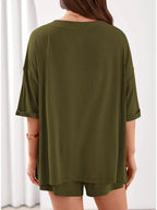 Women's casual V-neck top and shorts set in solid color, trendy two-piece outfit by Trendsi, perfect for relaxed everyday wear.