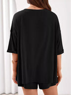 Women's casual V-neck top and shorts set in solid color, stylish two-piece outfit from Trendsi.