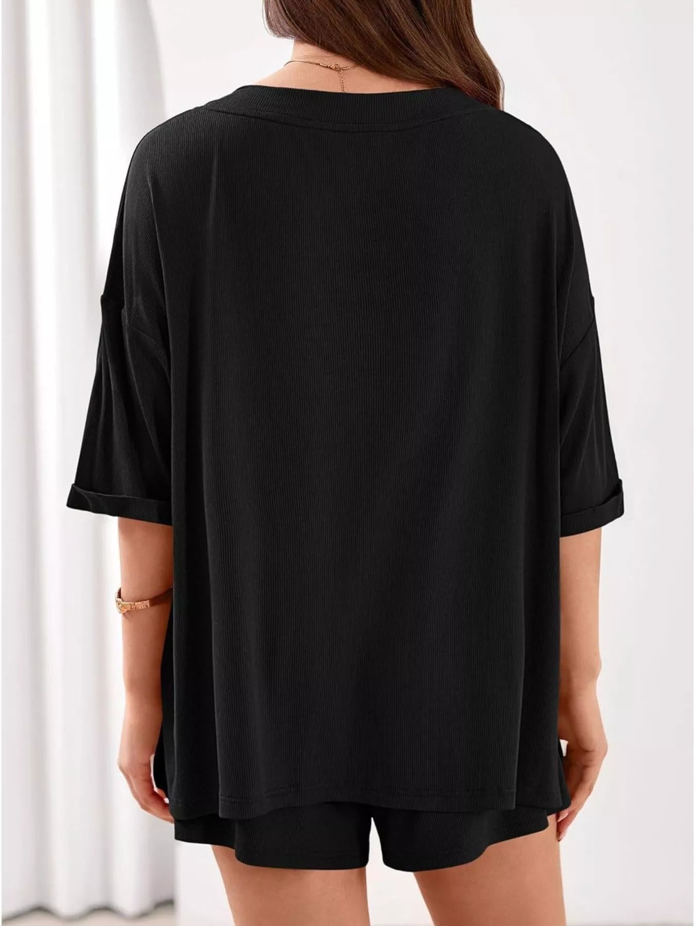 Women's casual V-neck top and shorts set in solid color, stylish two-piece outfit from Trendsi.