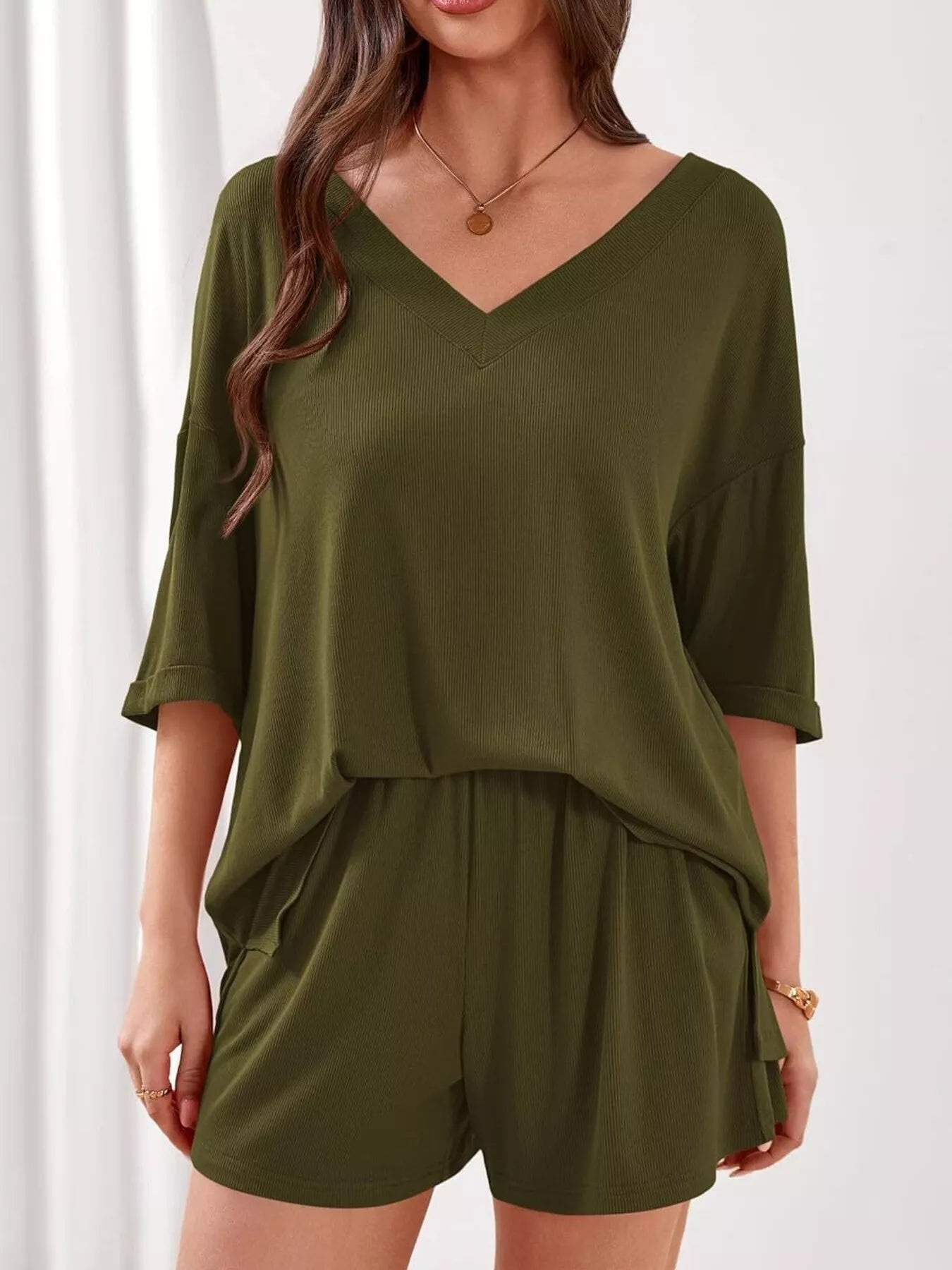 Women's casual V-neck top and shorts set in solid color, trendy two-piece clothing set for relaxed style and comfort.
