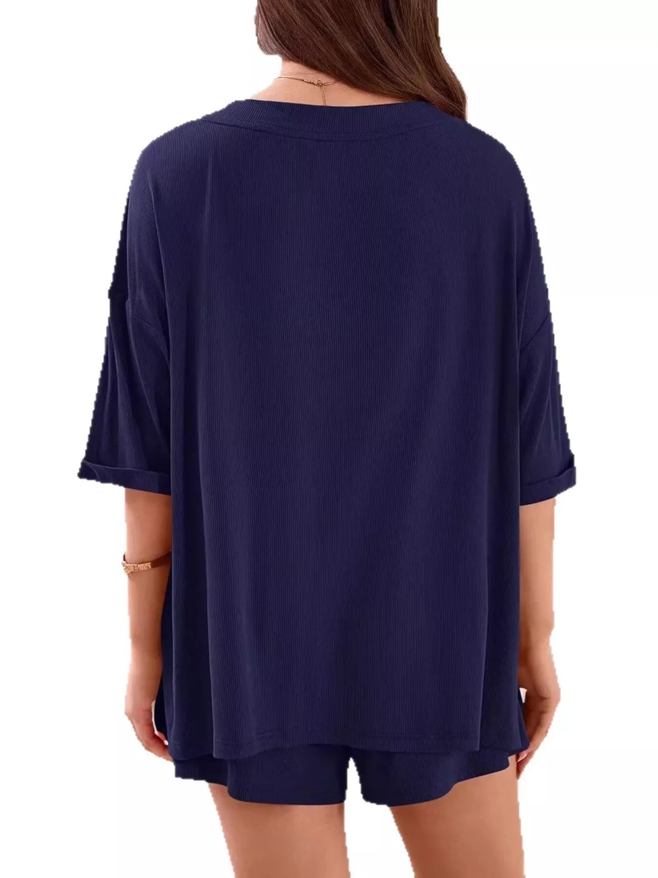 Women's casual V-neck top and shorts set by Trendsi, solid color two-piece outfit, perfect for relaxed everyday wear.