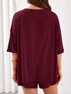 Women's casual V-neck top and shorts set in solid color, trendy two-piece outfit perfect for everyday wear.